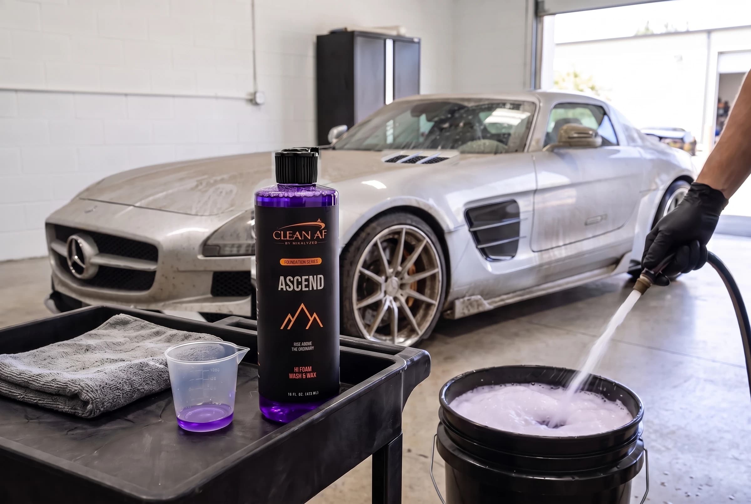 Dirty silver SLS behind ASCEND and a wash bucket being filled