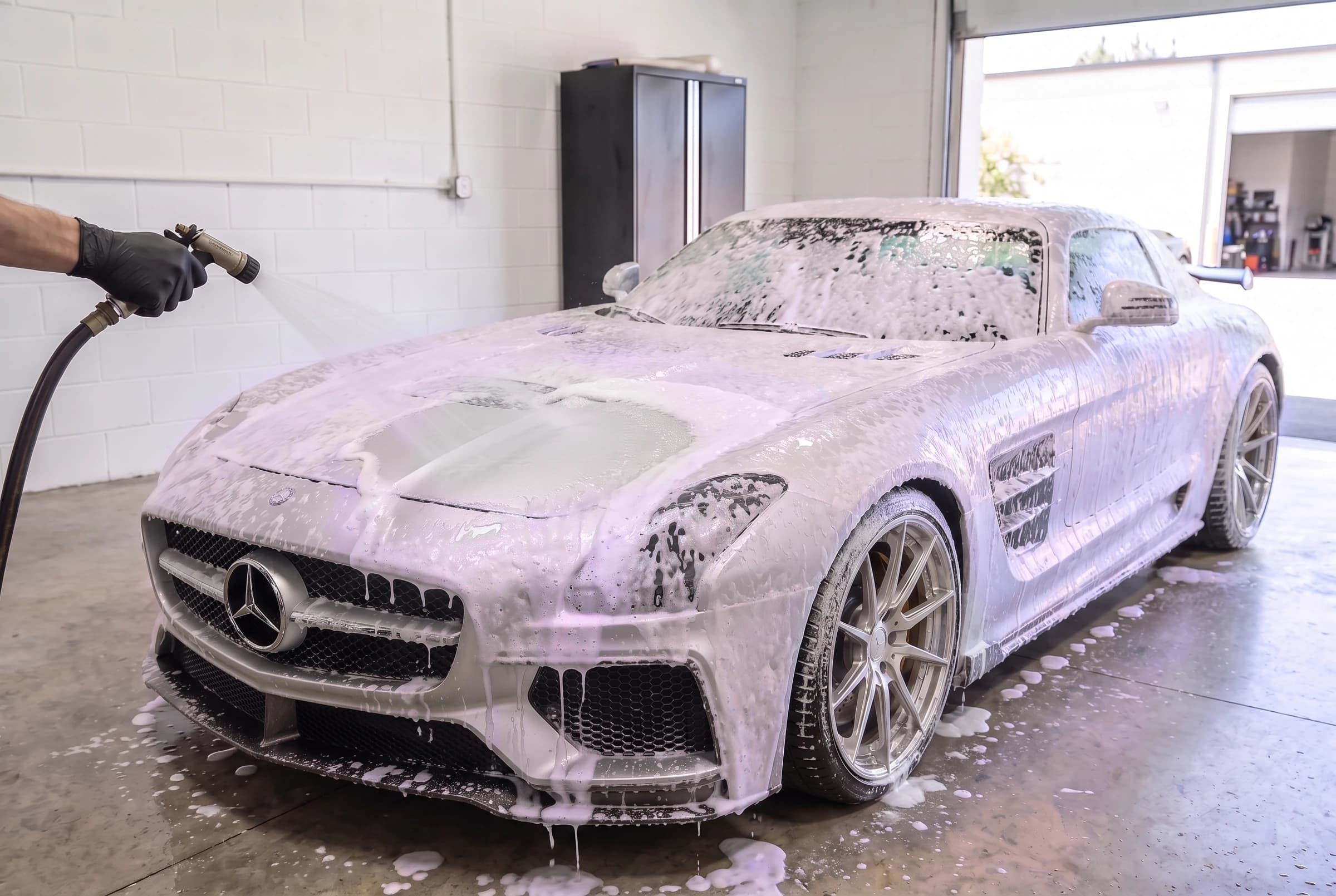 Clear water rinsing foam from the silver SLS