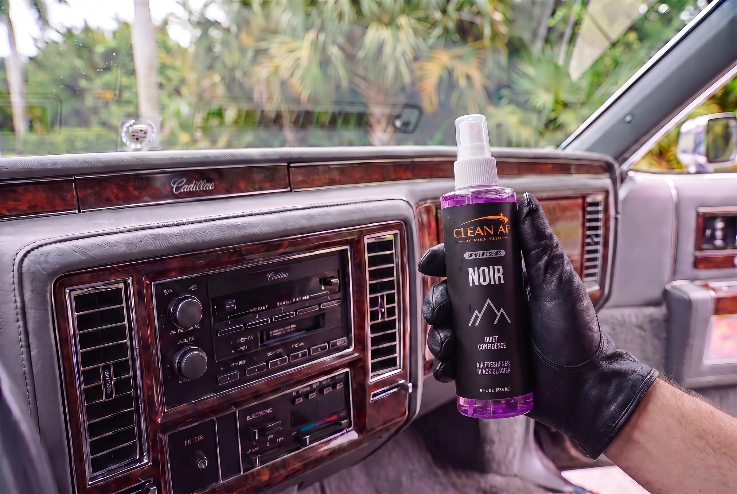 NOIR held beside the actual Cadillac air-conditioning controls