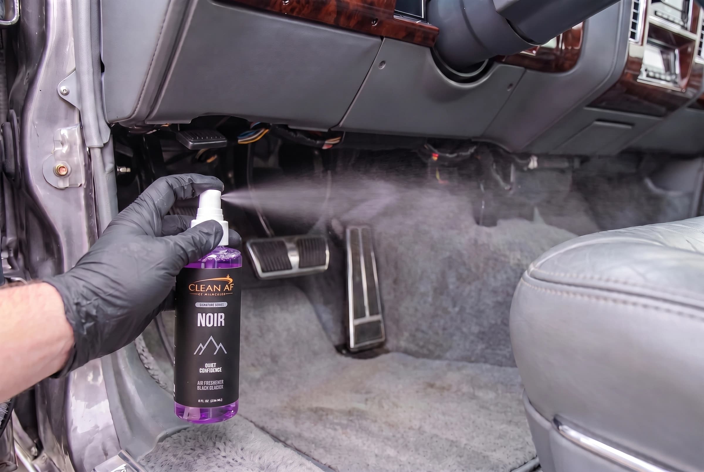 The original NOIR finger pump spraying beneath the dashboard into the air above the pedals