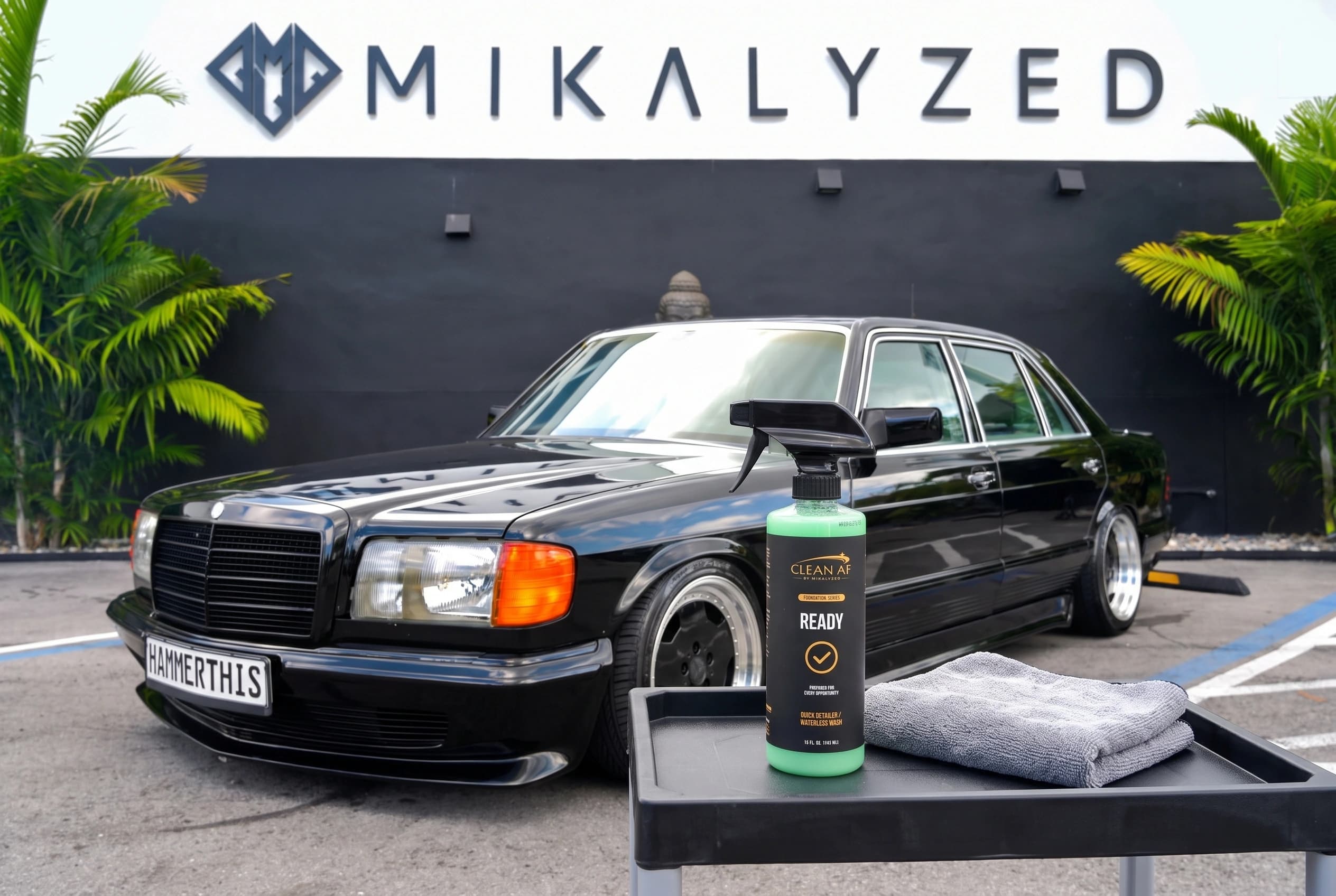 READY beside the finished black Mercedes hood and a folded microfiber towel